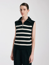 a lady in navy blue striped knitted vest